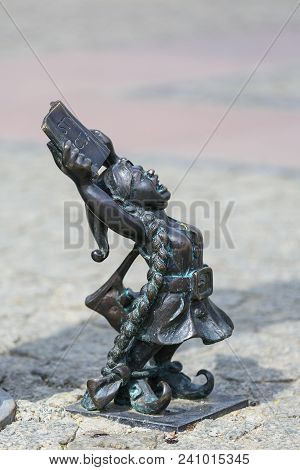 Wroclaw, Poland - April 15, 2017: Dwarf Women Symbol Of Democracy With The Polish Constitution In Ha