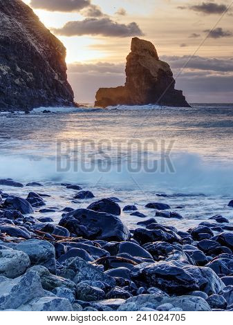 Tranquil Stony Bay In Scotland After Sunset.  Slow Shutter Speed For Smooth Water Level And Dreamy E