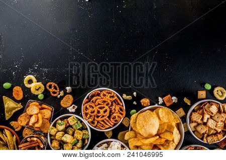 Variation Different Unhealthy Snacks Crackers, Sweet Salted Popcorn, Tortillas, Nuts, Straws, Bretse