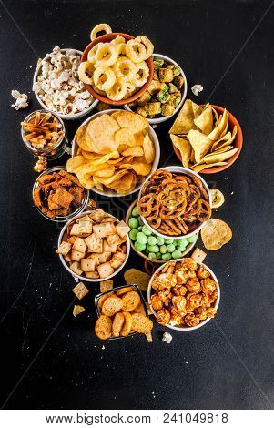 Variation Different Unhealthy Snacks Crackers, Sweet Salted Popcorn, Tortillas, Nuts, Straws, Bretse