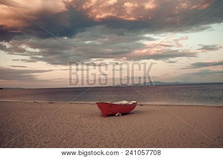 Fishermens Boat At Seacoast, On Sand At Sunset With Horisont Sea On Background. Background Of Sea Wi