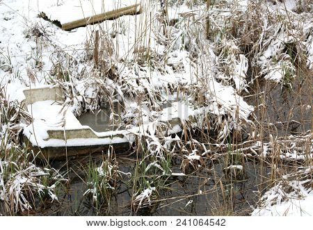 Wreck Of A Boat Route By The Lake In Winter With Snow
