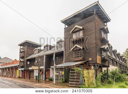 Howick, South Africa - March 23, 2018: Businesses In A Wooden Building At The Howick Falls In The Kw