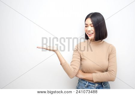 Young Asian Women Showhand For Present Something With Happy Emotion Isolated On White Background.