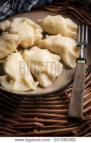 Homemade Dumplings With Cheese On A Plate.
