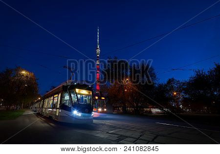 Moscow, May, 9, 2018: View Of Russian Modern Tramway At Station With Front Lights, Tv Tower Ostankin