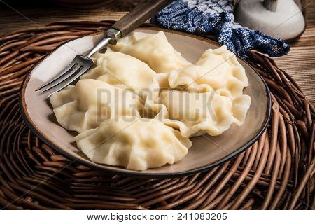 Homemade Dumplings With Cheese On A Plate.