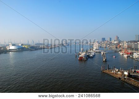 Aerial View Of Hamburg Port, A Sunny Day. The Port Of Hamburg Is A Sea Port On The River Elbe In Ham