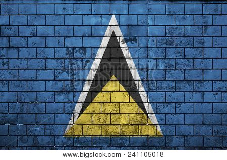 Saint Lucia Flag Is Painted Onto An Old Brick Wall