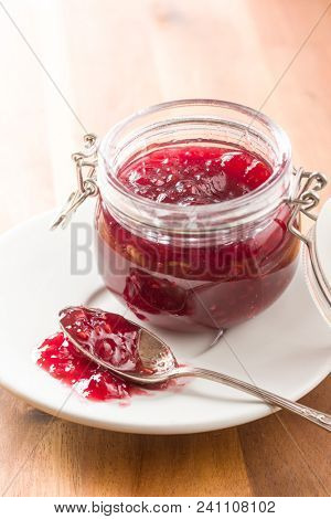 Raspberry jam jelly in jar.