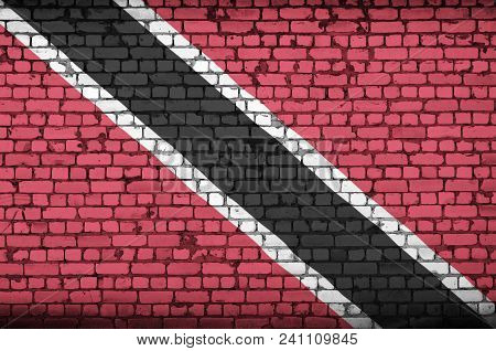 Trinidad And Tobago Flag Is Painted Onto An Old Brick Wall