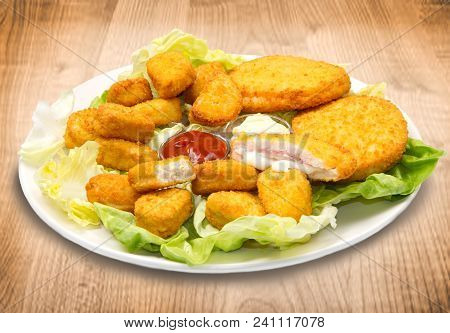 Dish With Nuggets With Ketchup And Mayonnaise