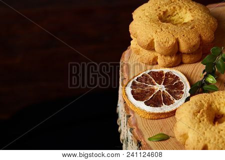 Christmas Concept With Asoortment Of Delicious Sweet Cookies, Cinnamon Sticks Bunch, A Couple Of Dri