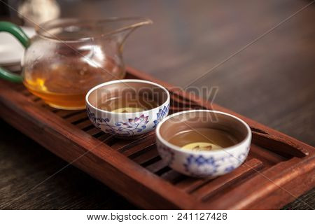 Cropped Shot Of Woman Holding Chawan With Green Oolong.