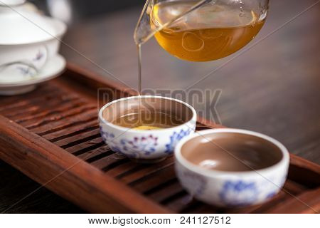 Cropped Shot Of Woman Holding Chawan With Green Oolong.