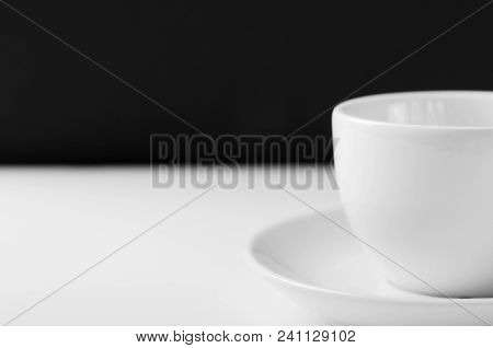 White Mug For Tea On A White Wooden Table On A Black Background.