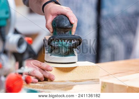 Working With Sanding Wood Bars Rotary Machine For Grinding On A Workbench In Motion