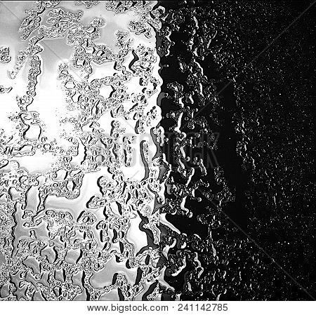 Rain On Glass. Glass As Mirror. Black An White.