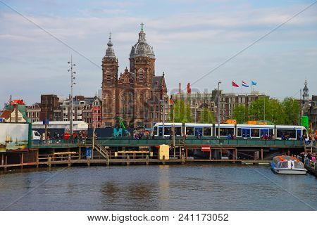 Amsterdam, Netherlands - May 2, 2013: Canal Boats And St Nicholas Church In Open Havenfront, Amsterd