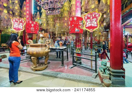 Can Tho, Vietnam - February 27, 2016: Woman Praying In Ong Temple In Can Tho, In Vietnam