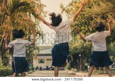 Group Of Friends Having Fun On Street In Primary School.