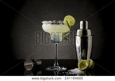 Classic Lime Margarita Cocktail With Tequila, Triple Sec, Lime Juice, Crushed Ice And Some Salt On T