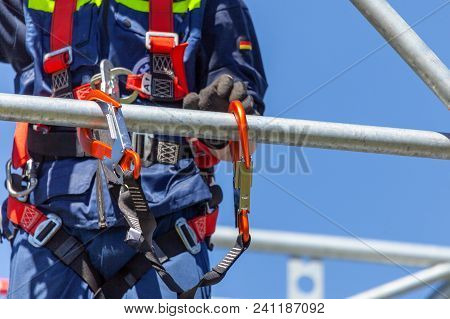 Man From German Technical Emergency Service Secured By A Carabiner Hook