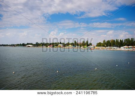 Lovely Beach With Many People Having A Rest