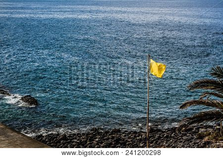 View To Atlantic Ocean And Yellow Flag On The Callao Salvaje Beach, Tenerife.