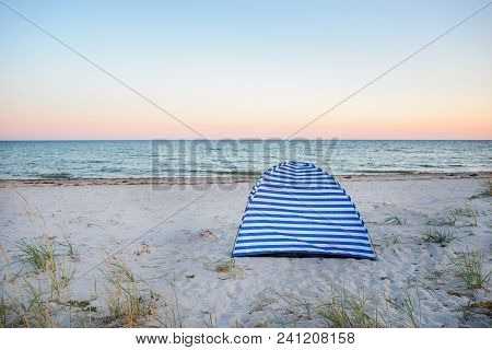 Tents On Beach Of White Sandunder Blue Sky