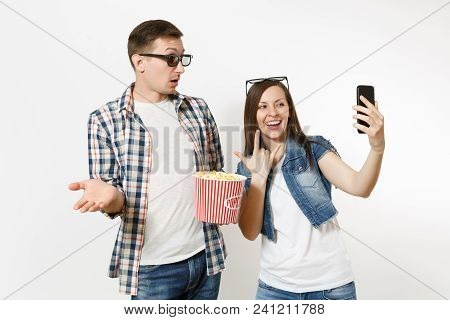 Young Couple, Woman And Man In 3d Glasses Watching Movie Film On Date Holding Bucket Of Popcorn Doin