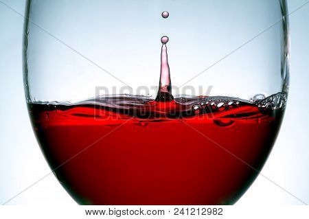 Red Wine In Glass, Splashing, Splash, Bubbles, Drops Of Wine Close Up Macro Texture Background