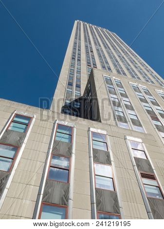 NEW YORK, NY USA - JAN 14 2013: Upward view of the Empire State Building and it's art deco facade designed by Shreve, Lamb & Harmon and opened April 11th 1931 