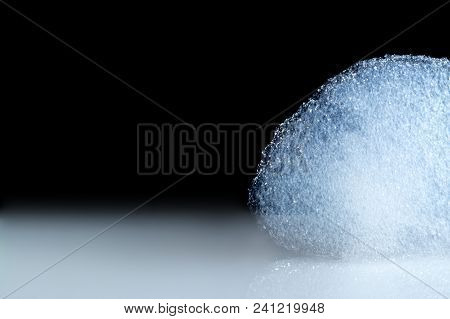 Foam, Bubbles On White Table Isolated On Black Background