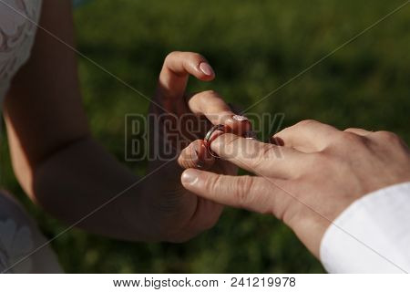 Man Giving An Engagement Ring To His Girlfriend