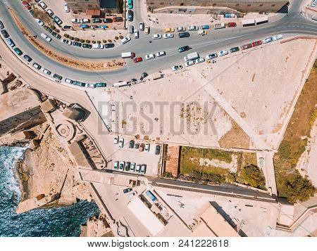 Aerial View Over Spinola Bay With Traditional Maltese Luzzu Fishing Boats