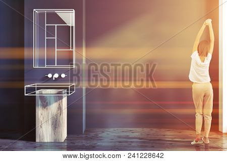 Futuristic Bathroom Interior With Gray Walls, A Glass And Wooden Bathtub. A Woman Stratching. 3d Ren