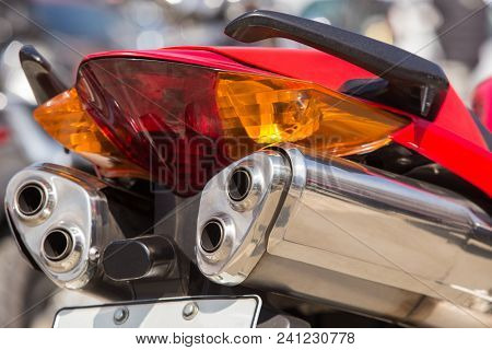 Powerful Motorcycle Exhaust Pipes Rear Closeup Photo