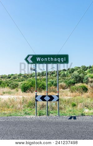 Road Sign At A Road Intersection Pointing To Wonthaggi In South Gippsland In Australia.