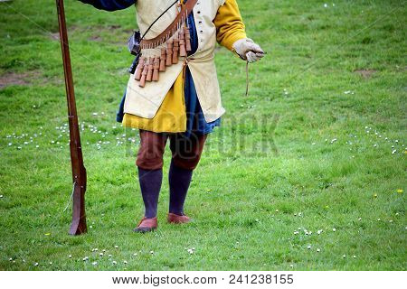 Falmouth, Cornwall, Uk - April 12 2018: Historical Military Re-enactor Dressed In Blue And Yellow Tu