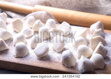 Pelmeni. Uncooked Pelmeni On A Board. Russian Food