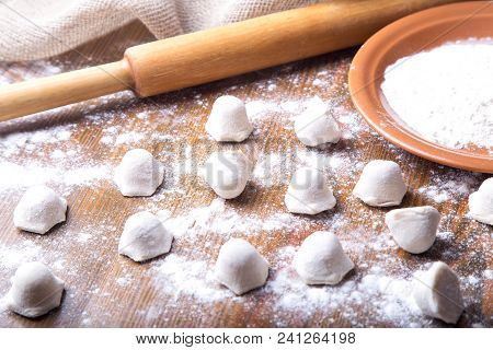 Uncooked Russian Pelmeni. Process Of Making Pelmeni, Ravioli Or Dumplings With Meat