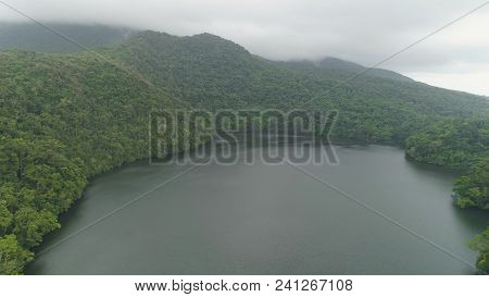 Aerial View Of Lake Bulusan In The Mountains With Green Rain Forest. Lake Hidden In The Jungle Mount