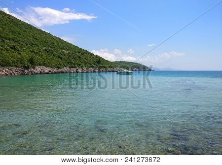 View Of The Coast Of Montenegro.  Turquoise Sea Water On The Ploce Beach.