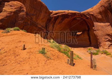 Eye Of The Eagle Big Hogan. Pothole Natural Arch Eroded In Sandstone. Navajo Tribal Park Of Monument