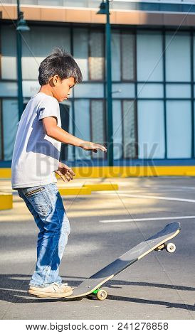 Bonifacio Global City, Taguig City, April 2, 2015: Skater Practicing In A Parking Lot In Bonifacio G