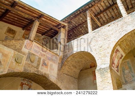 San Giminiano, Italy - May 26, 2016: The Decorations And Frescoes Of The Town Hall Courtyard