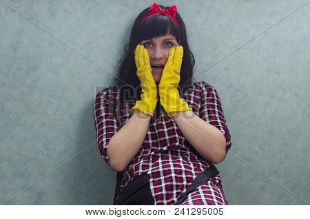 Brunette Girl In Yellow Gloves With Open Mouth