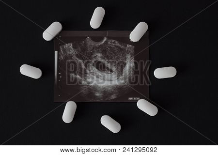 Uzi, Pregnancy Tablets And Abortion, Black Background