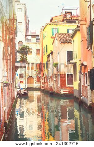 Traitional Venice Canal With Reflection Of Houses, Italy, Toned Image